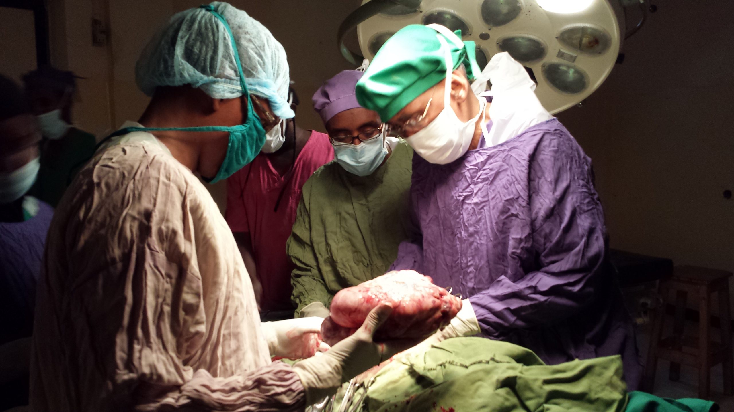 Dr.Giama operating patient
