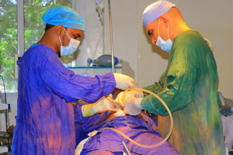Dr.Abdalla and Dr.Mazen using the Laser Machine on a patient at GMCH